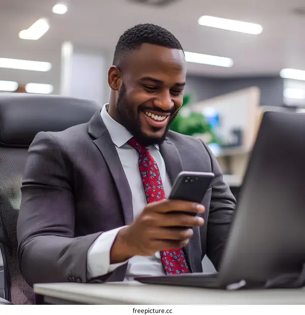 Smiling African American Businessman Checking His Phone