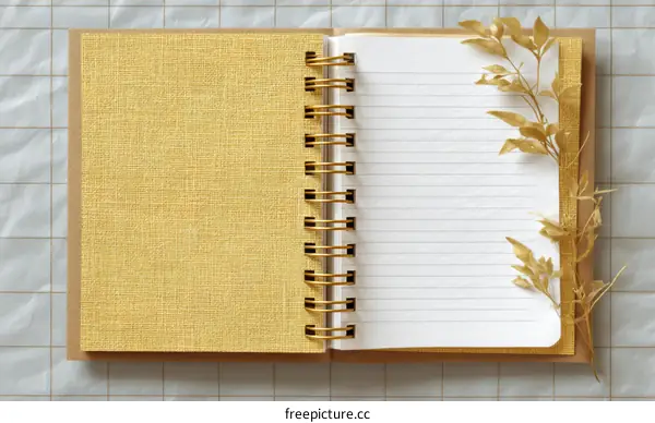 Open Spiral-Bound Notebook with Gold Accents