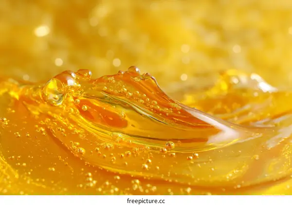 Close-up View of Golden Liquid with Bubbles