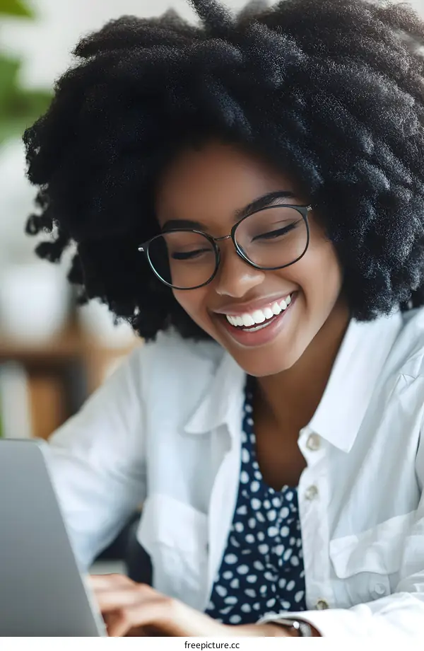 Happy Black Woman Using Laptop Computer