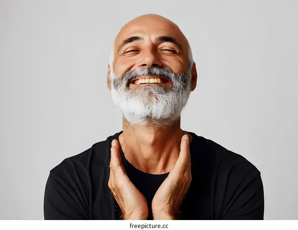 Portrait of a happy bald man with white beard