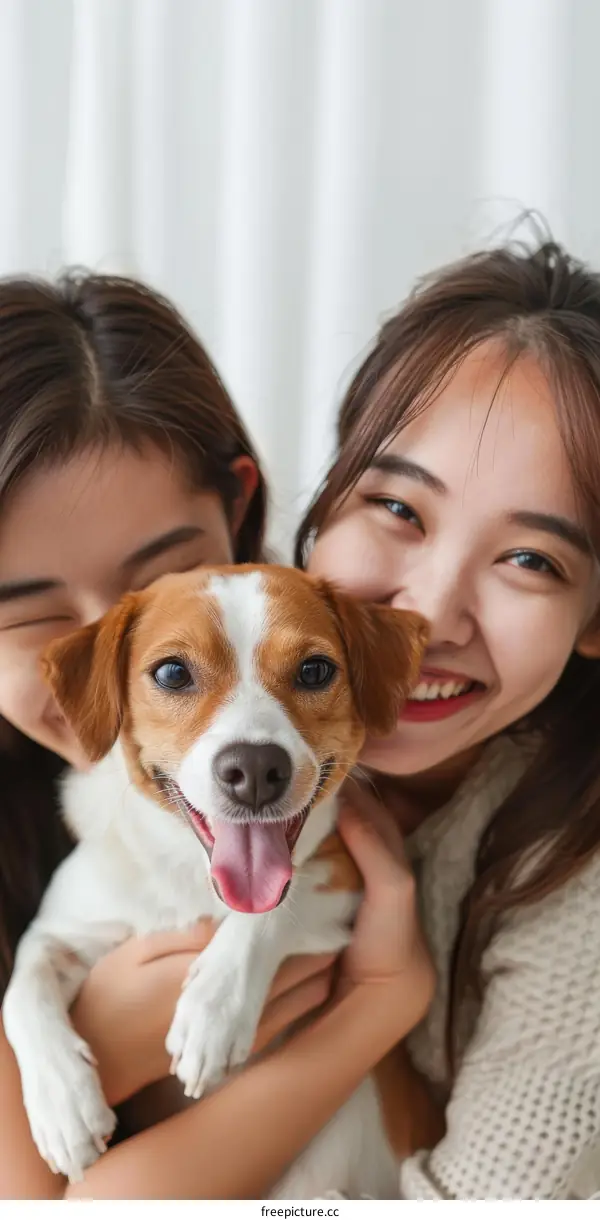 Two Asian women with a dog