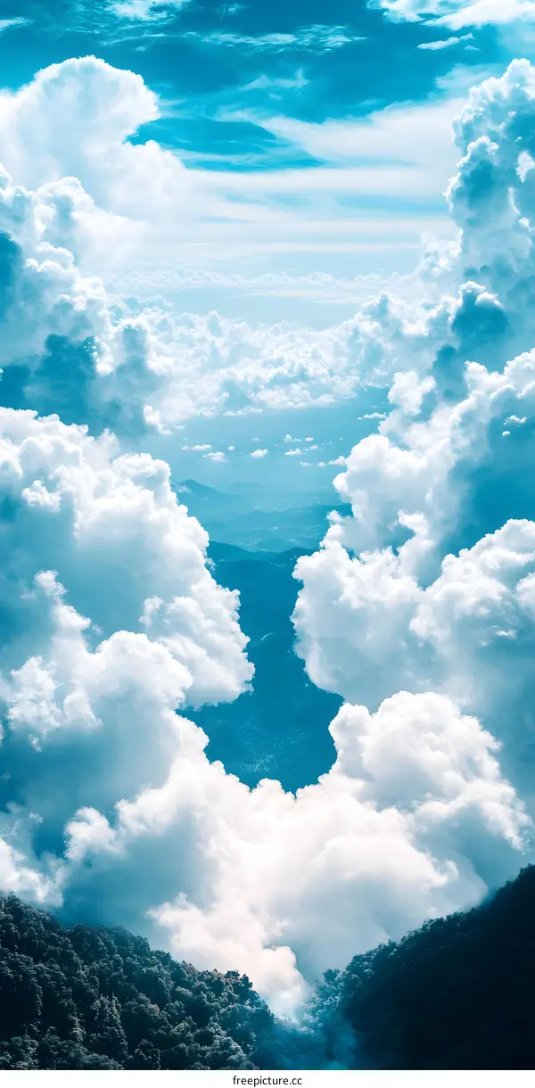 White Fluffy Clouds Above Lush Green Mountains