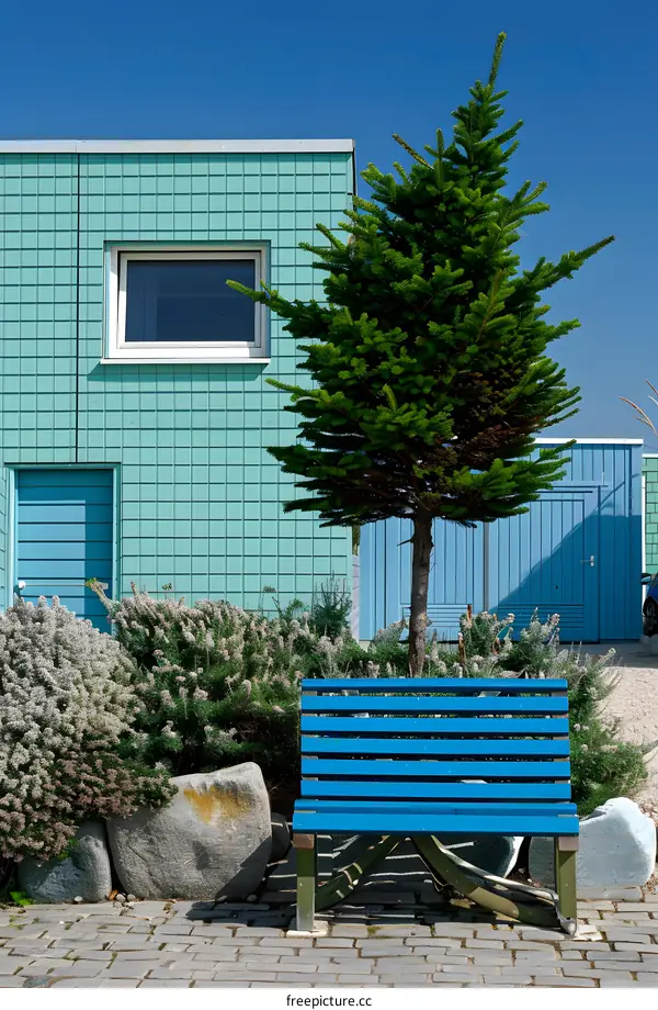 Blue Bench in Front of a Green Building