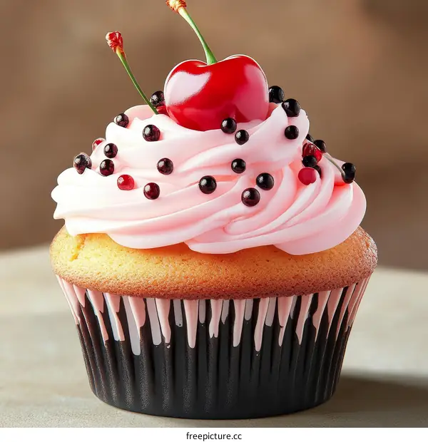 Delicious Pink Cupcake with Cherry