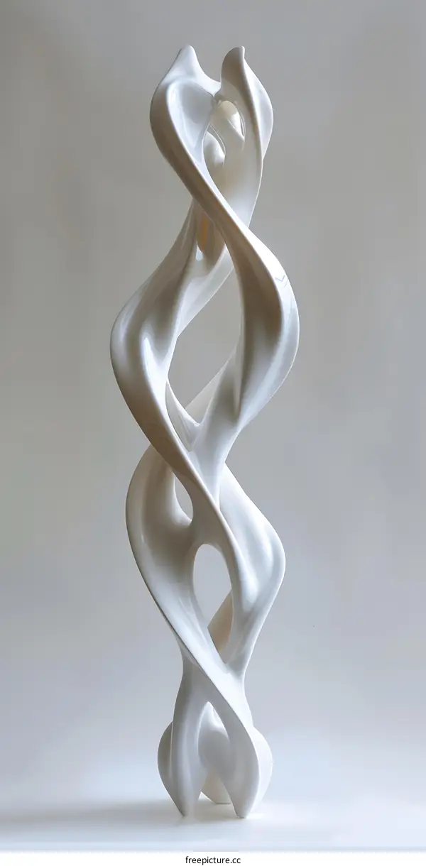 white sculpture of two intertwined organic forms