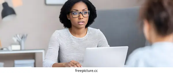 African American Woman Business Professional Working on Laptop