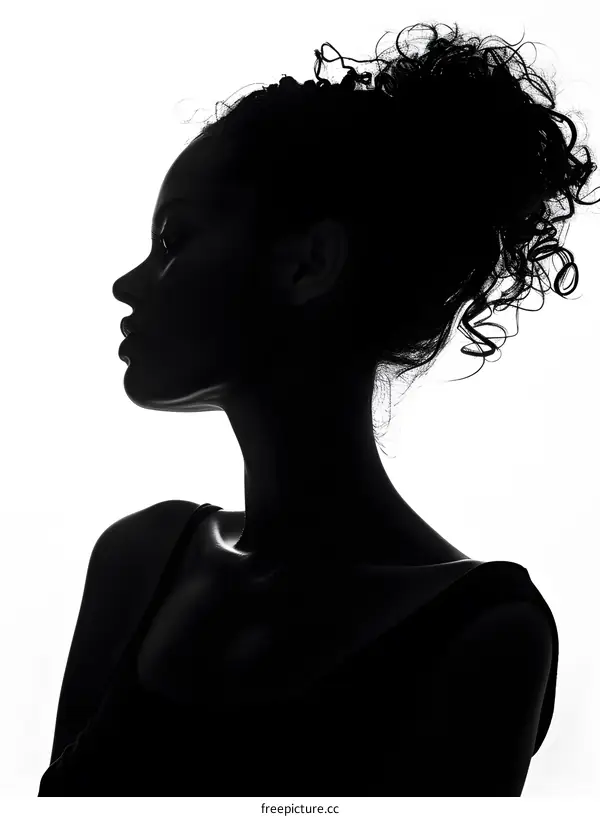 Silhouette of a woman with curly hair