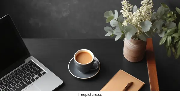 Modern Workspace Setup with Laptop and Coffee