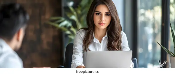 Business Woman Working on Laptop in Office