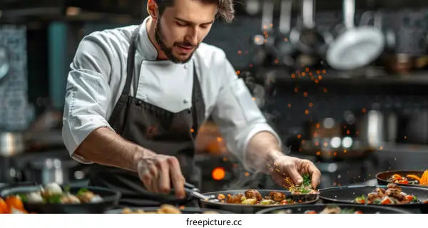 Focused male chef cooking in a restaurant kitchen