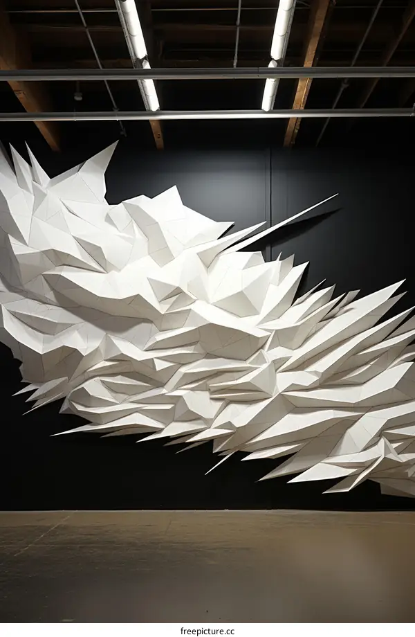 Three-dimensional white origami mountain range wall sculpture