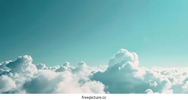 White Fluffy Clouds Against a Turquoise Sky