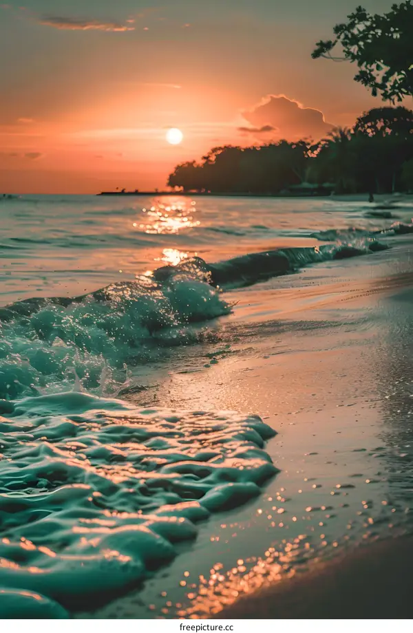 Sunset Over Tropical Beach With Foamy Waves
