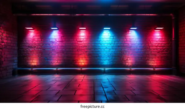 Glowing lights in a dark room with brick walls and concrete floor