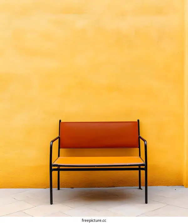 Orange Chair Against Yellow Wall