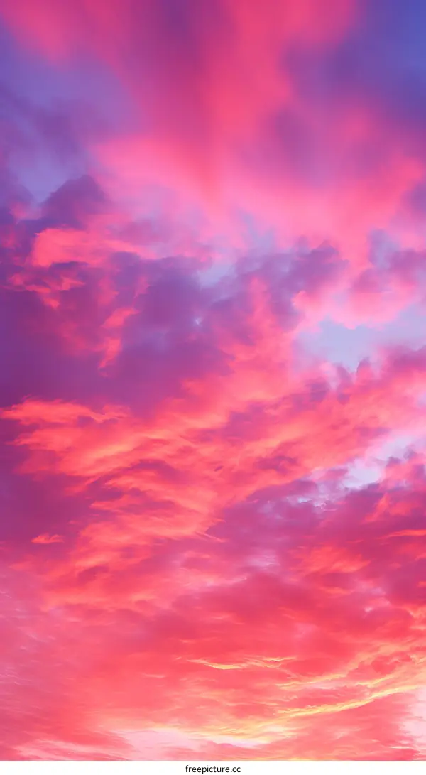 gradient pink and blue sky with clouds