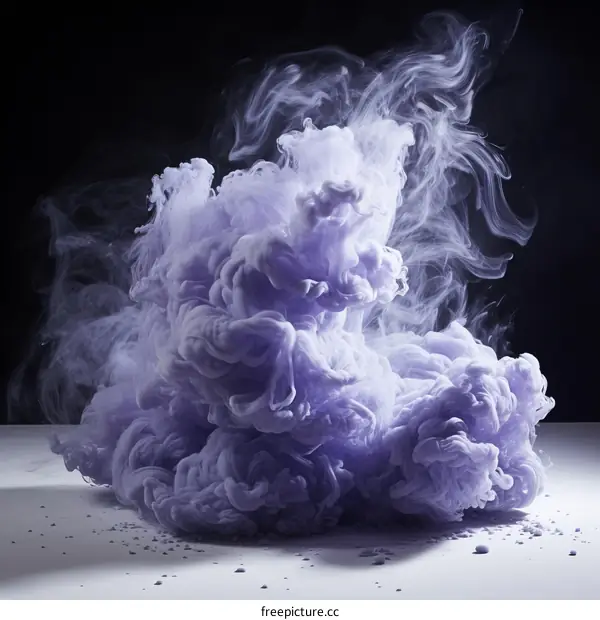 Purple smoke cloud on white surface with black background