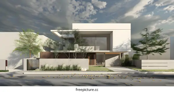 Modern White House with  Grey Concrete Wall and Green Landscaping