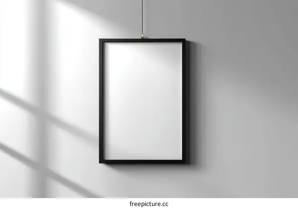 Blank Black Framed Poster Mockup on White Wall