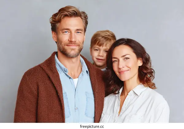 Happy Family Portrait Against a Gray Background