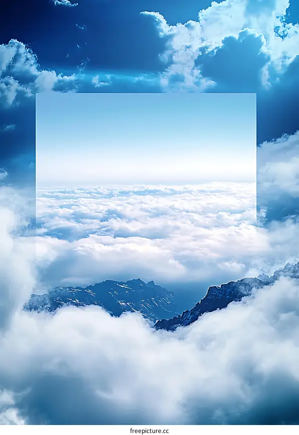 White Clouds Surrounding Mountain Peaks with Clear Blue Sky