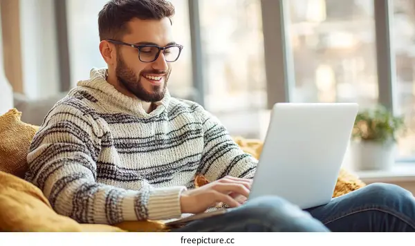 Man Working on Laptop at Home