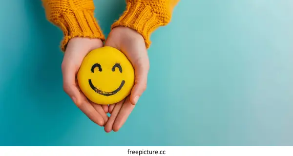 Smiling Face Held by Gentle Hands