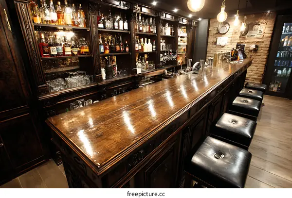 Elegant Dark Wood Bar with Vintage Detailing