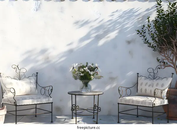 White Wall with Two Chairs and a Table