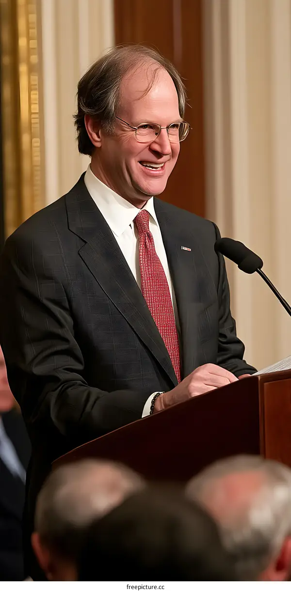Man in Suit Speaking at a Podium