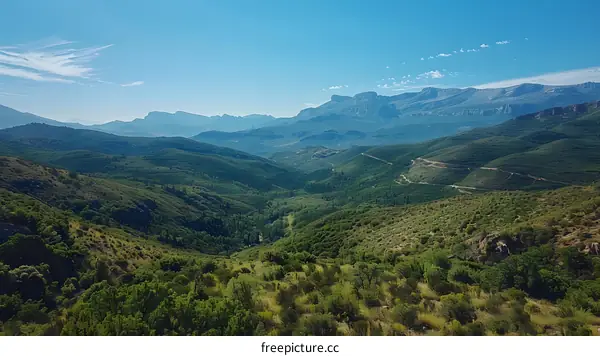 Vast mountain landscape under blue sky