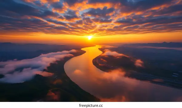 Aerial Sunrise View of a River Winding Through a Valley