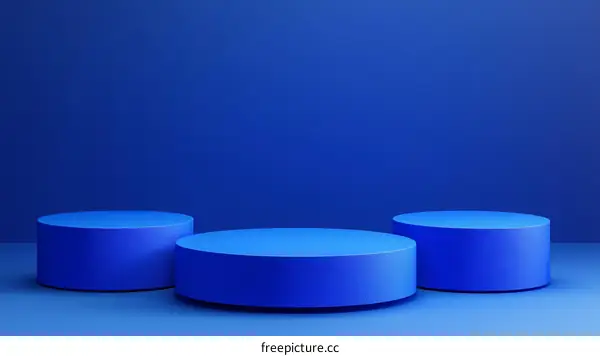 Three Blue Cylindrical Podiums on a Blue Background