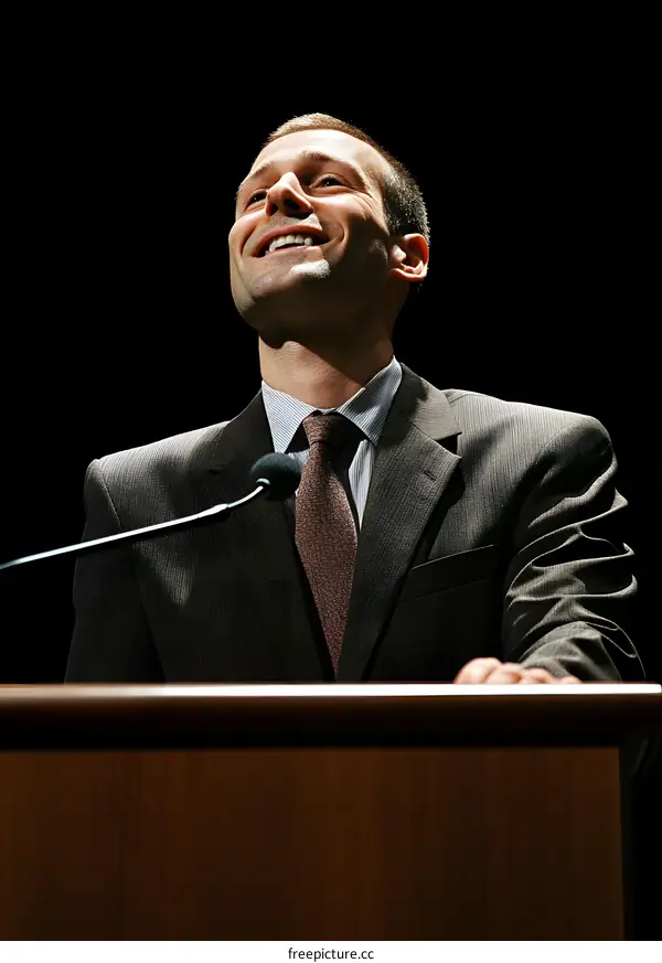 Man in Suit Giving a Speech at a Podium