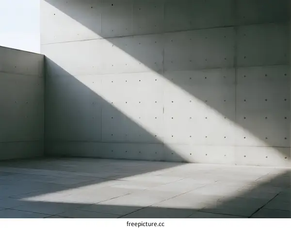 Concrete Wall with Geometric Shadows in Minimalist Architecture Space