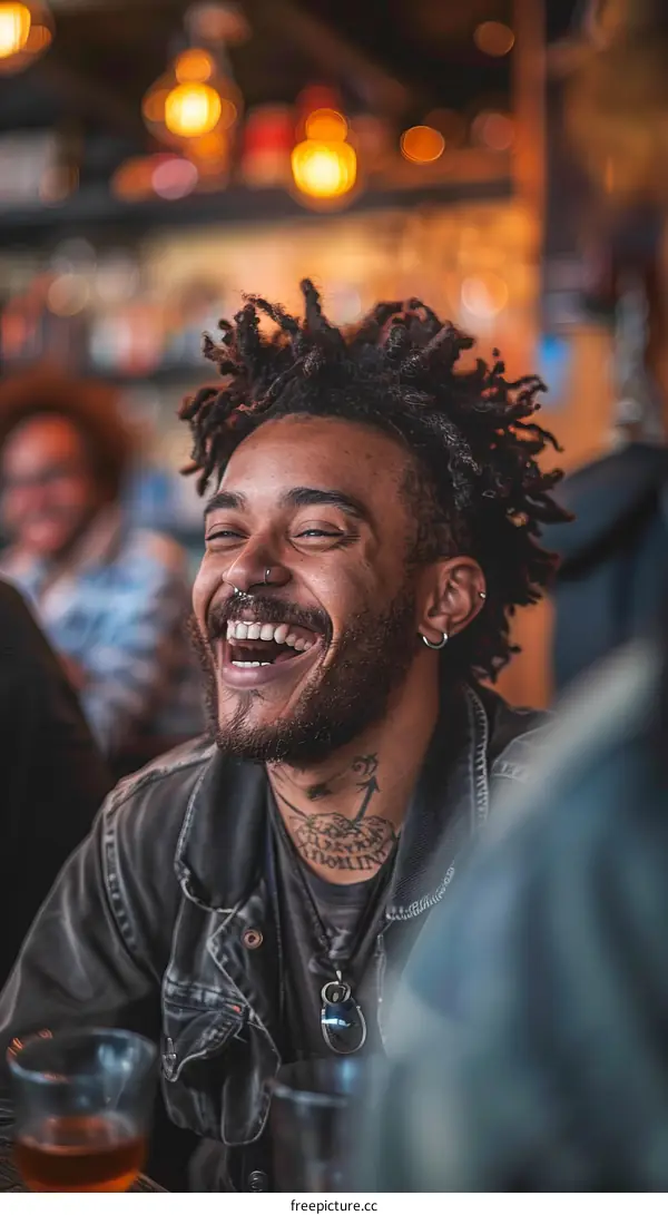 Laughing man with dreadlocks