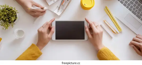 Two Women Working on a Tablet