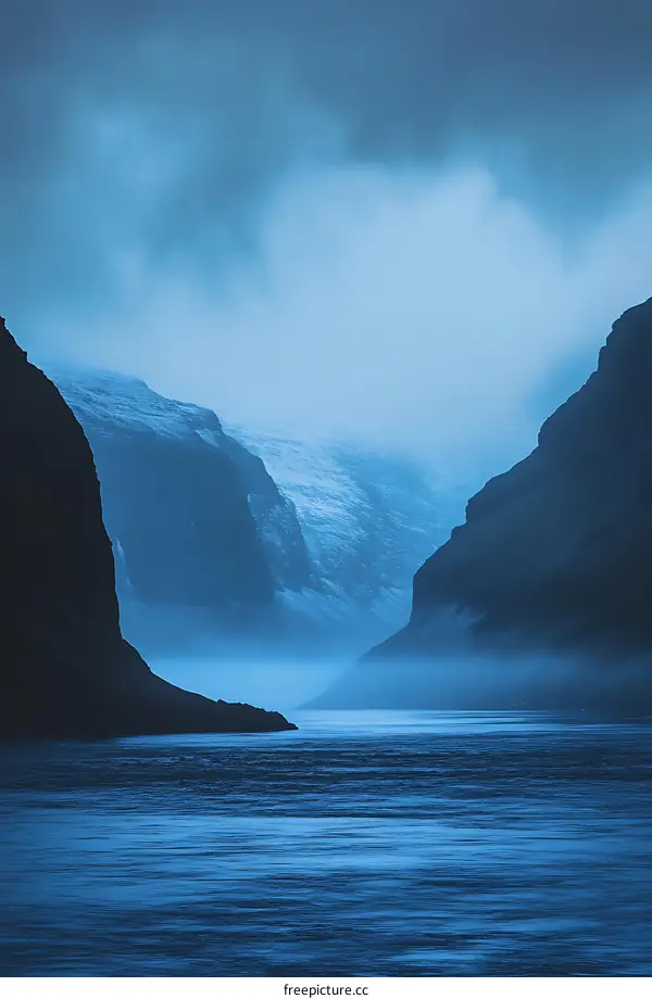 Foggy Mountain Landscape with Blue Sky and Water