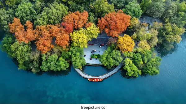 Autumn Colors Over Scenic Lake Park with Wooden Walkway