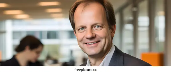 Smiling Man in Office Setting