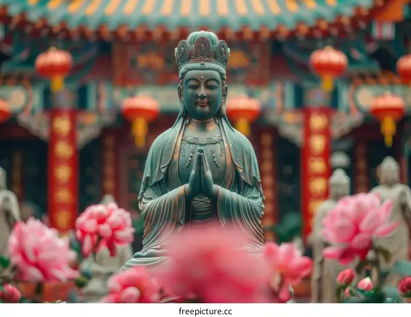 White Guanyin Statue with Pink Lotus Flowers