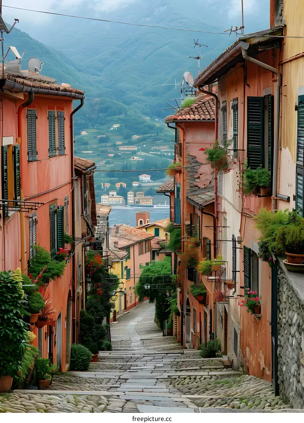 A steep and narrow street in a colorful Italian town