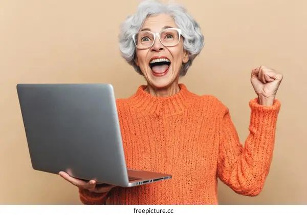 Excited Senior Woman with Laptop