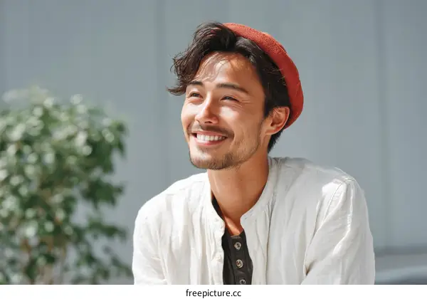 Smiling Asian Man Outdoors in Casual Outfit
