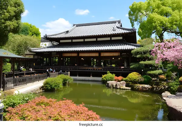Traditional Japanese Garden with Wooden Building and Pond