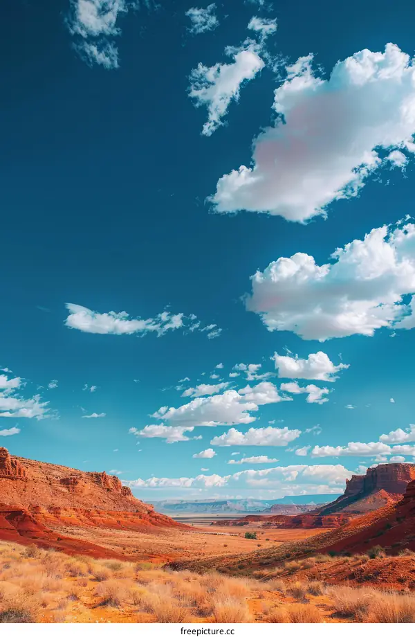 Arid Desert Landscape with Red Stone Formations and Blue Sky