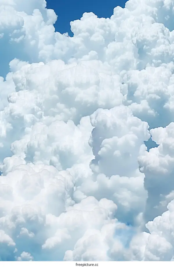 White cloudscape with blue sky background