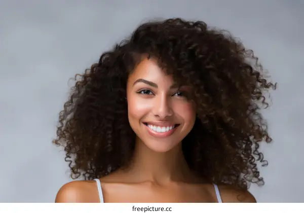 portrait of a young african american woman with curly hair