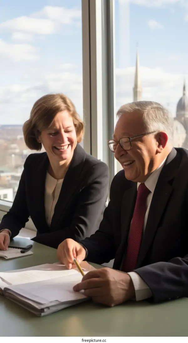 Two people are having a meeting in an office.